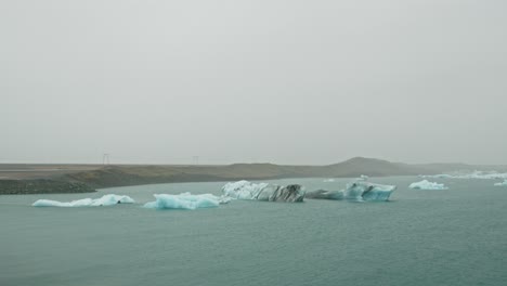 stunning view of icebergs on a beautiful lake on an overcast day