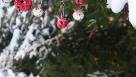 outdoor snow covered christmas tree stylish decoration, red and white bell baubles