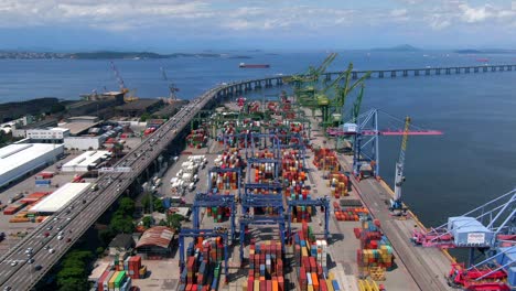 aerial view of shipping docks and container port next to rio-niteroi bridge in rio de janeiro, brazil