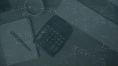 mathematical equations against calculator falling on study desk