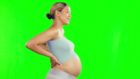 Pregnant,-back-pain-and-woman-with-cramps-on-green