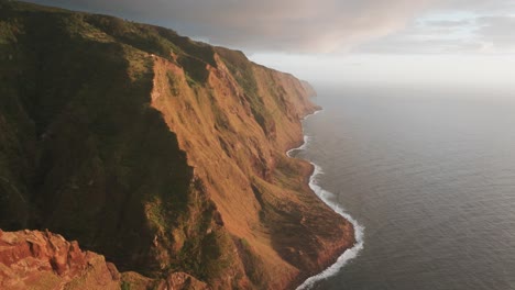 pullback shot of sunset at ponta da ladeira viewpoint in west madeira, portugal