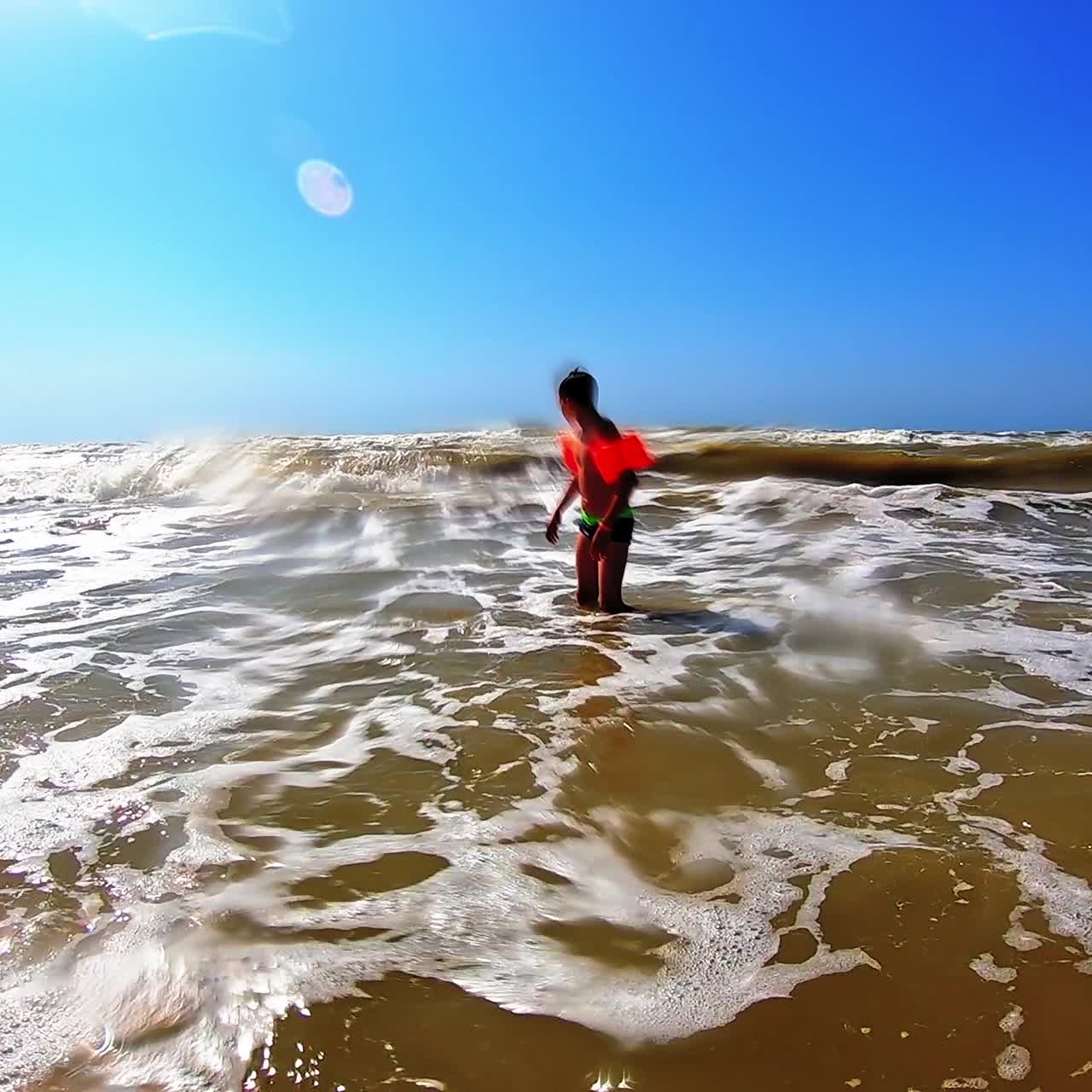 Boy playing on beach