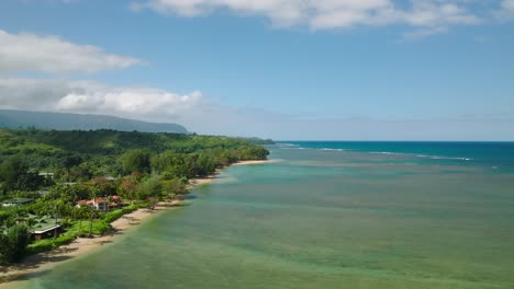 extreme wide slow aerial orbit above anini beach, kauai, hawaii