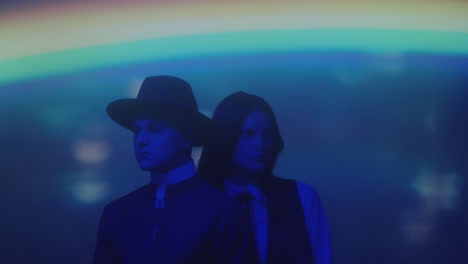couple dressed like priest and schoolgirl in neon light