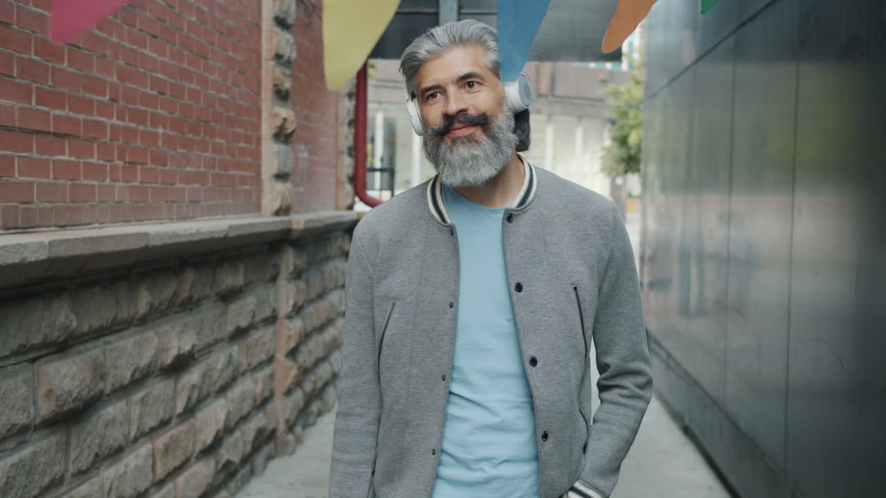 Stylish man walking in an urban alleyway