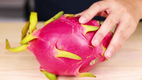 cutting and revealing dragon fruit interior