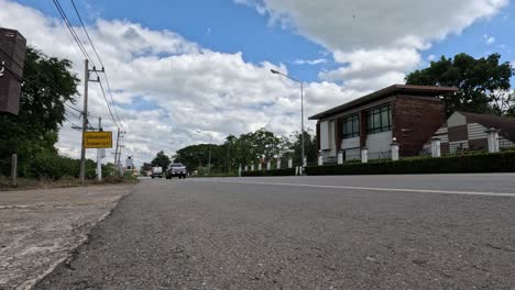 car passing through a quiet country crossroad.