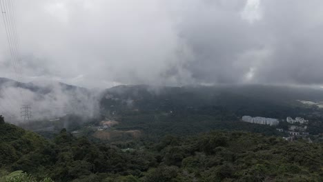 low overcast cloud drifts into tanah rata valley in malaysia mountains