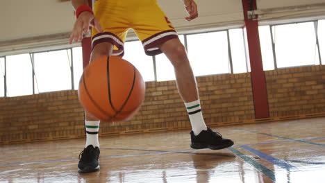 basketball players practicing dribbling drill