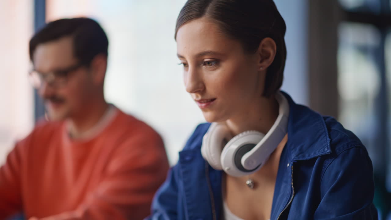 Office partners working online laptops at workplace closeup. Smiling man woman