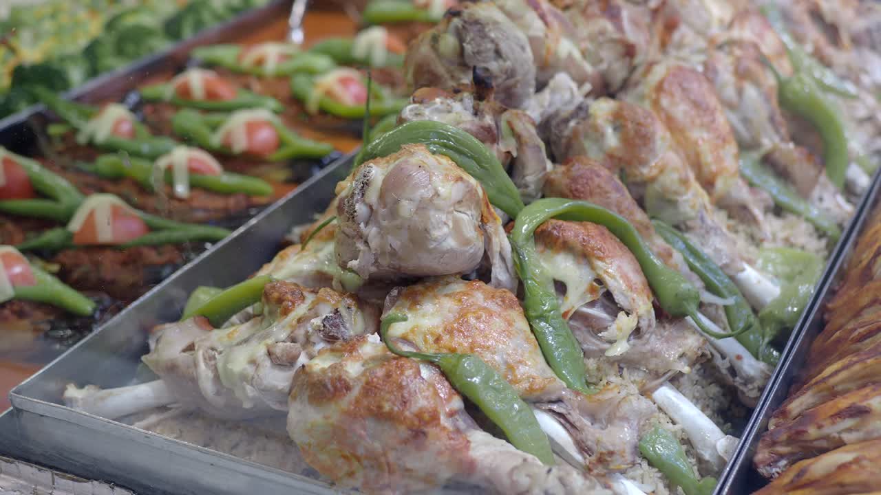 Tray of Roasted Chicken Drumsticks and Rice with Green Peppers