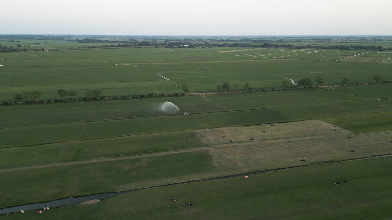 Water sprayer in agriculture fields of Belgium, aerial view