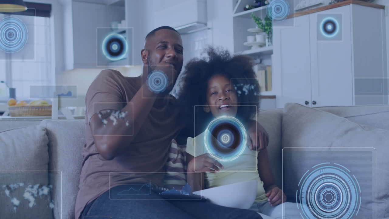 Animation of data processing against african american father and son watching tv at home