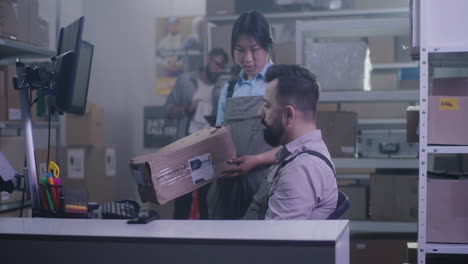 warehouse staff checking a package