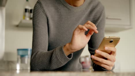 man using mobile phone at home 4k