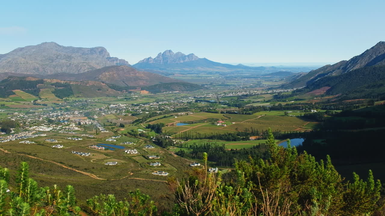 Slider view over lush Franschhoek valley landscape surrounded by mountains