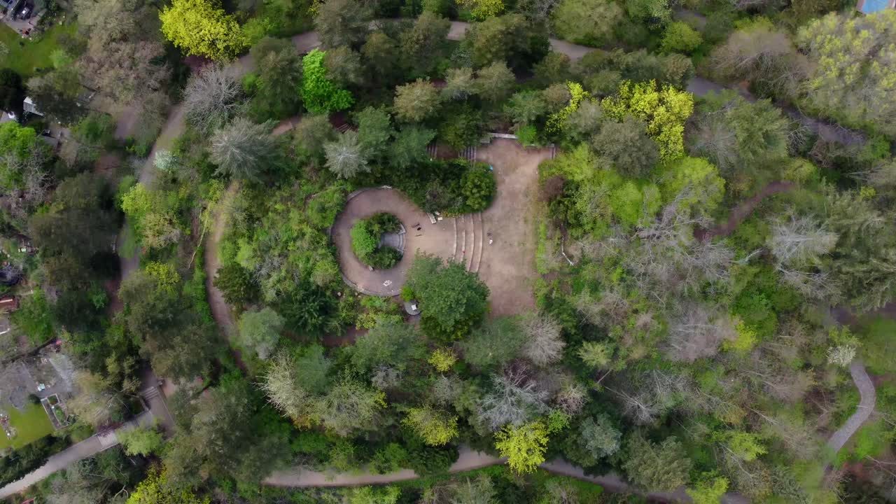 Trees Stairs and a monument Stunning aerial view flight rotation 360 drone shot bird's eye view drone footage of Berlin Tempelhof Park District Spring 2022 Cinematic view from above by Philipp Marnitz