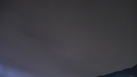 cloudy night sky timelapse hides the milky way galaxy in the background