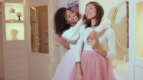 two happy women friends in a fashion store