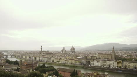 slow motion pan above the ancient rooftops of rainy florence, italy