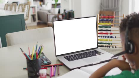 African-american-boy-using-laptop-with-copy-space-on-screen