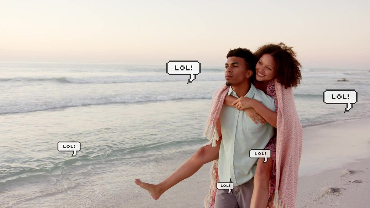 Man carrying her piggyback dusk shore blanket wrapping as LOL bubbles popping over couple marketing