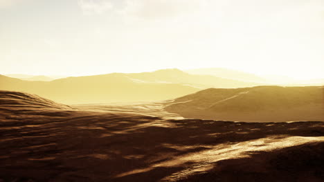 sunset over the sand dunes in the desert