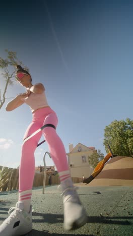 woman working out outdoors with resistance band