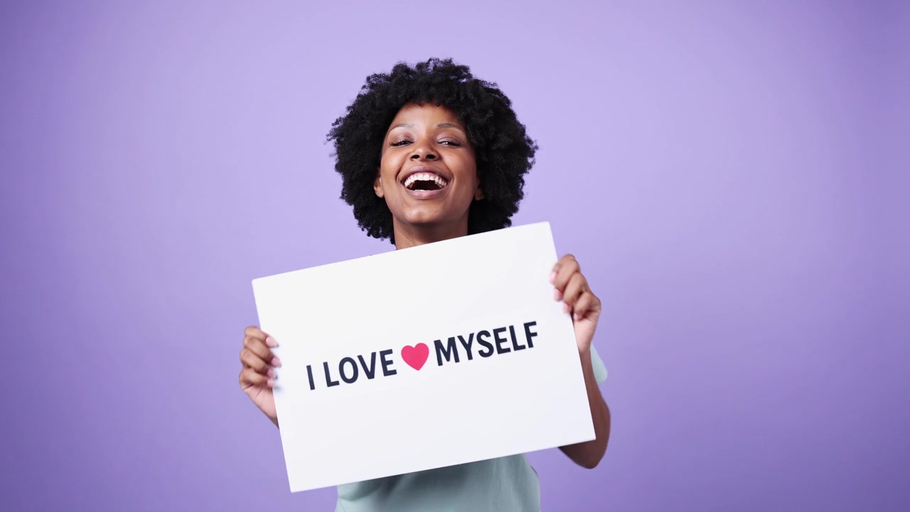 Happy Young Black Woman Holding 'I Love Myself' Sign
