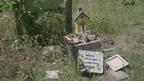 a bird feeder in a community garden at day time