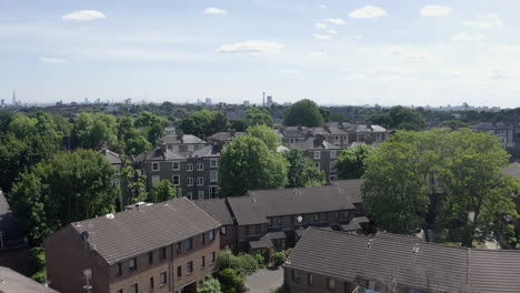 low aerial flyover of old brick rowhouses in archway, london, england
