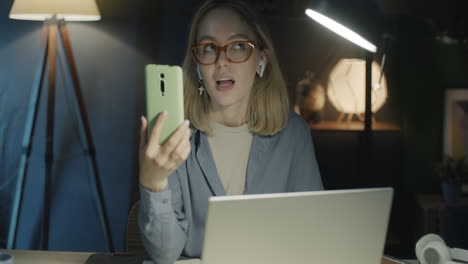 woman having a video call at night at home