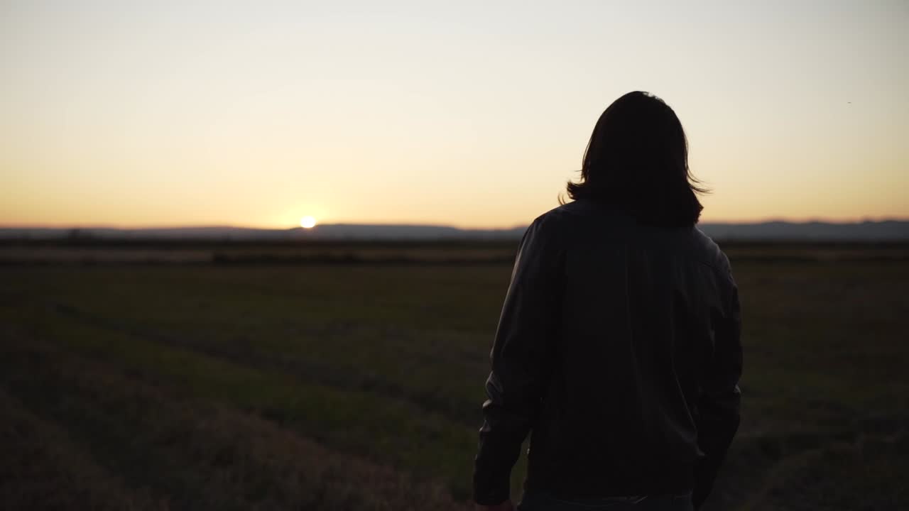 Woman Silhouetted at Sunset