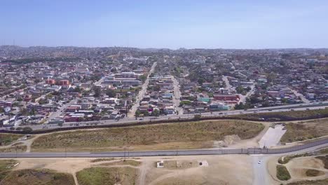 high aerial over the border wall fence separating the us from mexico and san diego from tijuana 2