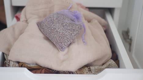 drawer with clothes and lavender sachet
