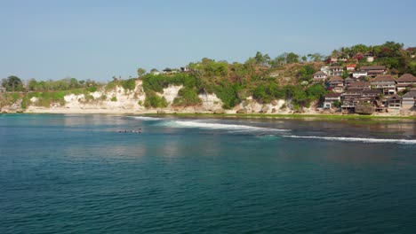 the surf spot of bingin at the cliffs of uluwatu during a sunny day