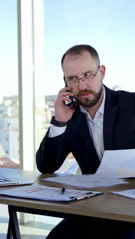 serious businessman working with documents. man working everyday job at modern office