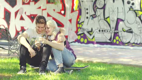 young couple relaxing in an urban park