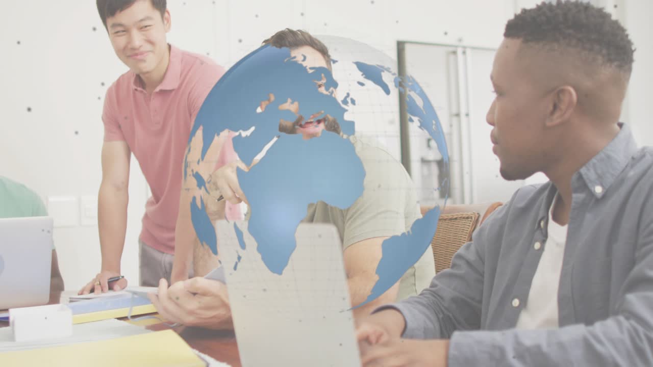 Presenter raising fist and explaining global strategy as 3D globe rotating during business meeting