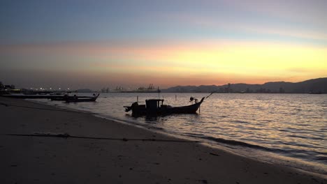 Silhouette-fishing-boat-at-beach