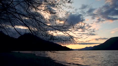 inspiration sunset on lake with mountains in background