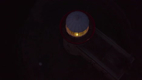 rotating top down view of a lighthouse at night