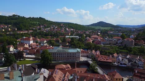 Magic-aerial-top-view-flight-Czech-Republic-historical-Cesky-Krumlov-Vltava-river-church-in-summer-time-2023,-world-heritage-in-Bohemia