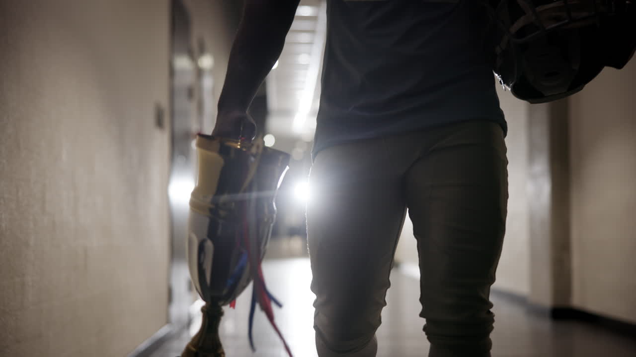 Football Player with Trophy