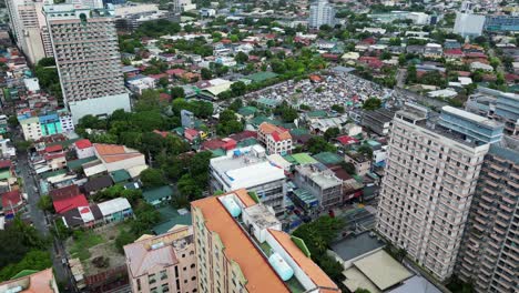 aerial view of high-rise buildings, residential houses and squatter area in west crame, san juan city, philippines