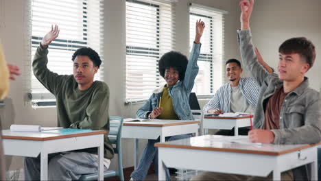 students raising hands in a classroom