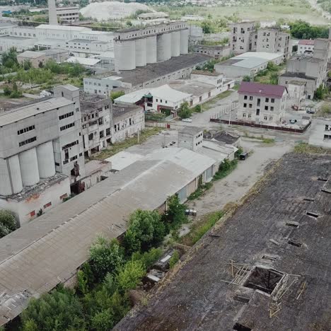 flight over the destroyed factory. old industrial building for demolition. aerial view