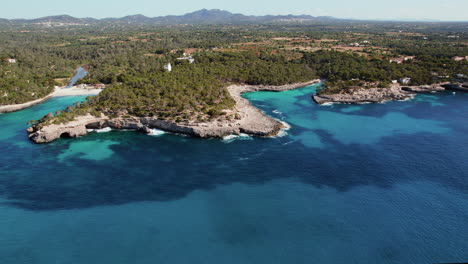 aerial view of two lovely beaches of cala mondrago and calo des borgit in mallorca, spain