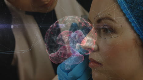 female doctor holding patient head with gloved hand in clinic, projecting holographic brain overlay